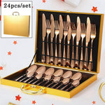 Gold knife and spoon set displayed with luxurious gift packaging.