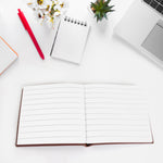 Chocolate scented notebook with a pen, ready for creative writing.