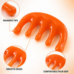 An orange scalp massager with magnified insets highlighting its rounded tips, smooth edges, and comfortable palm grip.