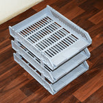 Three-layer desktop file rack drawer on a modern office desk.