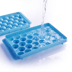 Hand pouring liquid candy mixture into the ChefAura Lollipop Candy Maker.