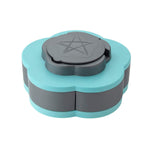 An open teal and gray petal-shaped box displays five compartments with various nuts and dried fruit, plus toothpicks in the