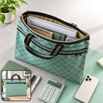 A green patterned document bag with an open zipper, showing papers and a notebook inside, alongside pens and a calculator.