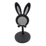 The Bunny Phone Stand in a home office setting, perfect for desk organization.