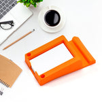 Multi-functional plastic business card and mobile holder in use