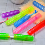 Six clear plastic travel toothbrush covers neatly stacked for hygienic storage.
