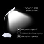 Portable LED desk light with intuitive touch controls on its base.