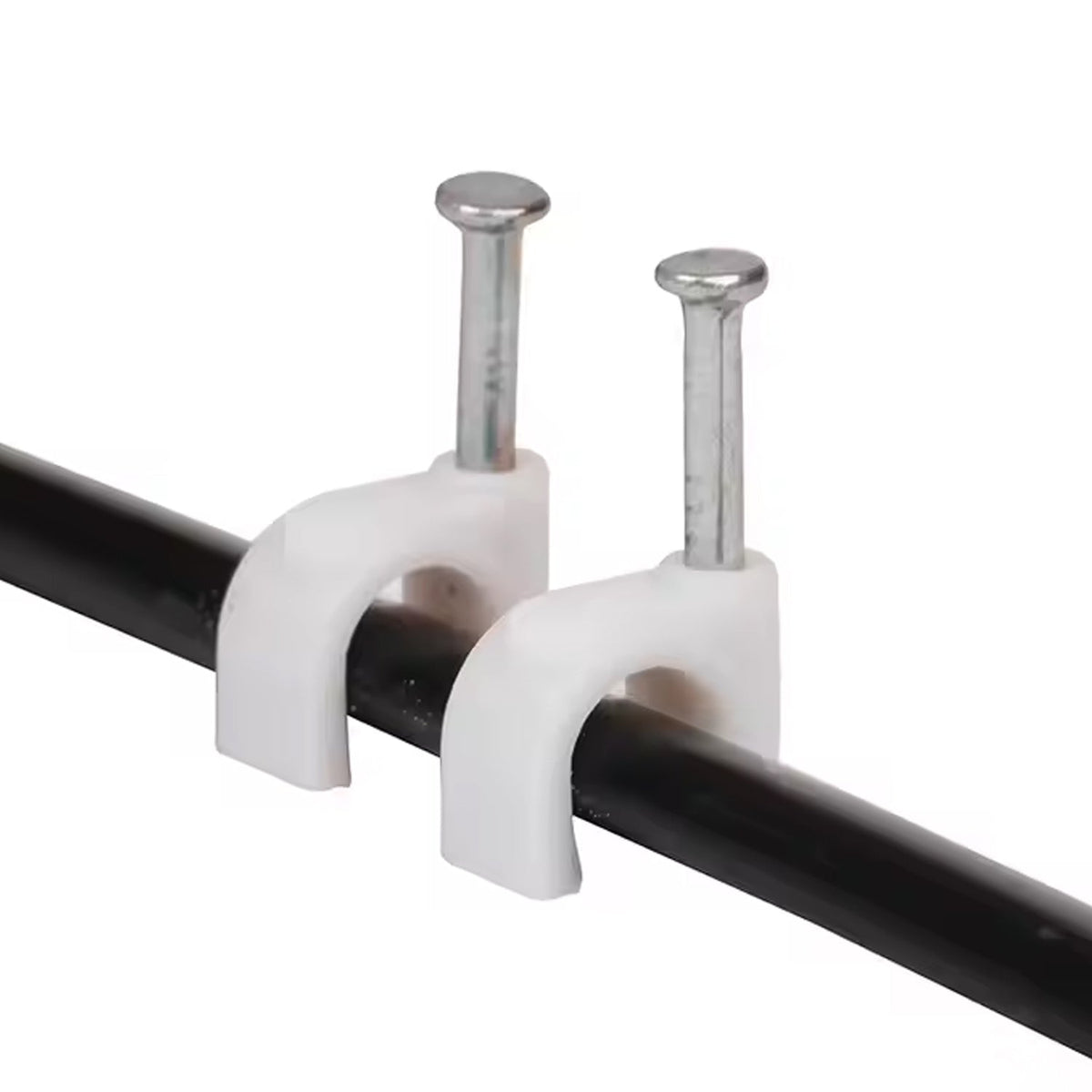 Two white plastic cable clips with nails securing a black cable against a white background.