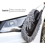 Person holding the comfortable grip of the Velvet Wheels Car Dust Brush, ready for detailed cleaning.