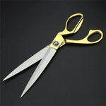Professional golden scissors demonstrating sharp cloth cutting capability.