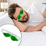 A man with a beard sleeps on a white pillow wearing a green gel eye mask, with an inset of the mask.