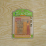 A 32-in-1 precision screwdriver set in its clear retail packaging with green and orange accents, on a wooden surface.