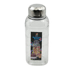 Transparent mukhwas bottle sitting on a kitchen counter with snacks