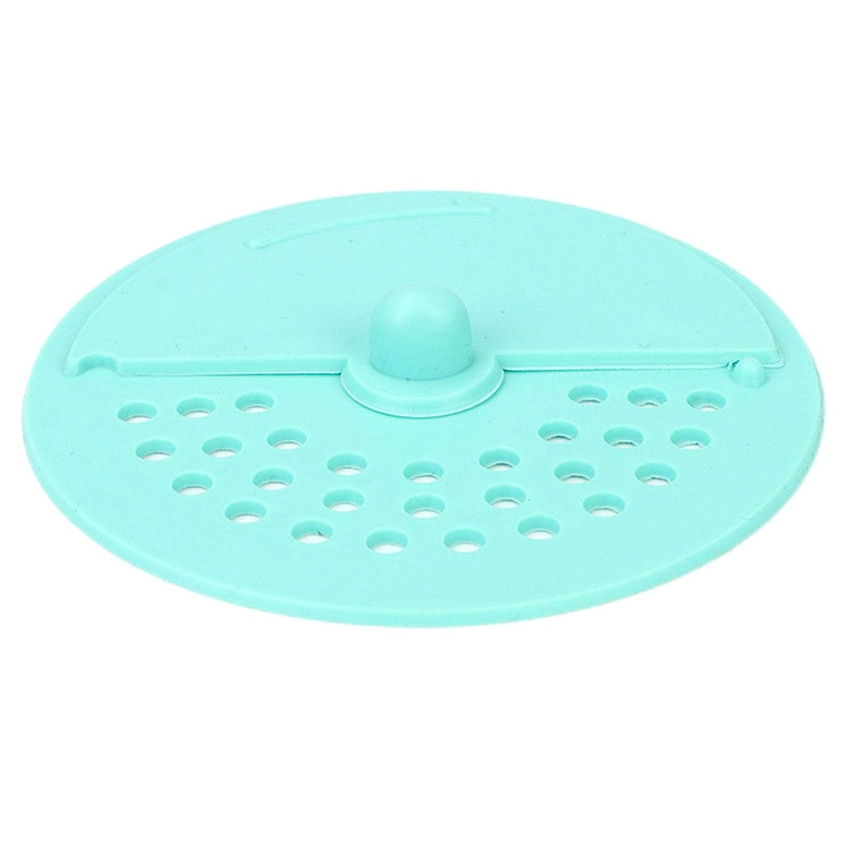 A light green silicone drain strainer with a central knob and two sections of holes is shown from above.