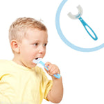 A boy in a yellow shirt brushes his teeth with a blue U-shaped toothbrush, with an inset of the toothbrush.