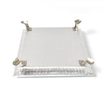 Silver pooja platform with a serene Ganesha carving, ideal for home temples and altars.