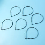 Single metal zigzag hair band showing black wavy style for men and women