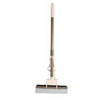 A user effortlessly cleaning a floor with the self-cleaning sponge mop, highlighting its maneuverability.