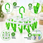 White and green drying rack with callouts for its detachable hook, strong grip, space-saving, and multipurpose use.
