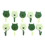 Ten cat-shaped wall hooks in alternating dark and light green colors arranged in two rows on a white background.
