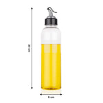 Hand pouring oil from the 1 litre transparent plastic oil dispenser with precise control.
