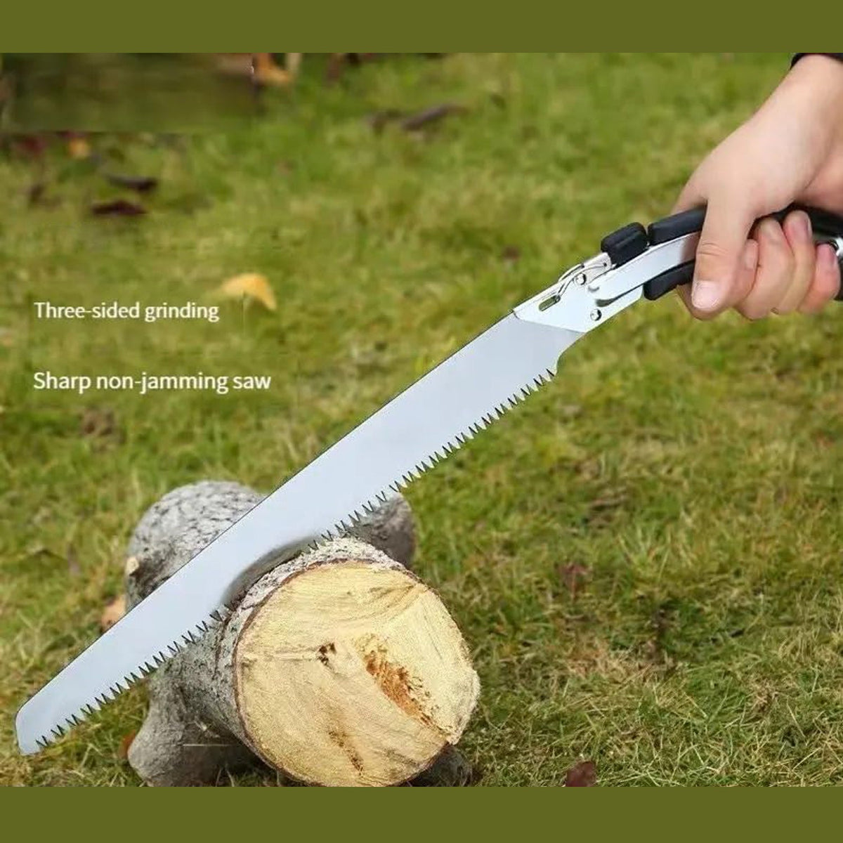 A silver folding hand saw cuts a log on green grass, with text overlays 'Three-sided grinding' and 'Sharp non-jamming saw'.