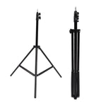 Portable DSLR camera tripod folded for easy transport, highlighting its lightweight design.