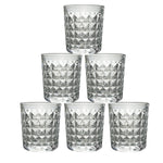 A stack of elegant diamond-cut glass tumblers, illustrating their compact storage and design.