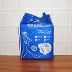 A pack of Sanitary Pads 330mm next to a single pad, showcasing both the product and its packaging.