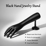 Palm side of black hand-shaped jewelry organizer stand