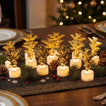 Twelve golden Christmas tree LED tealight candles illuminate a festive table setting with a blurred background.