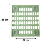 A light green pegboard with dimensions of 25 cm by 22 cm, showing four clear adhesive pads on the back.