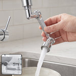 A hand adjusts a chrome swivel faucet aerator attached to a kitchen faucet, with water flowing into a bowl.