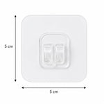 A single clear square adhesive hook with twin prongs, showing its dimensions of 5 cm by 5 cm on a white background.