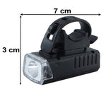 Black rectangular bicycle headlight with a clear lens shown with dimensions of 7 cm length and 3 cm height on a white