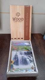 Decorative wooden wall panel with hooks, showing intricate vertical scenery.