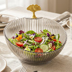 Fruit bowl with gold accent enhancing dining decor with fresh fruits