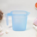 Ergonomic Transparent Bath Mug, highlighting its comfortable design.