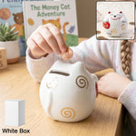 Cute ceramic cat piggy bank with glossy finish, perfect for saving coins.