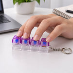 A hand presses down on the four purple and clear keyboard switches of a keychain on a white desk.