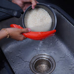Efficient strainer spoon for quick and hygienic rice washing.