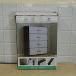 Cardboard box for a storage cabinet, showing an image of the product and assembly instructions.