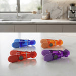 Colourful magnetic clips set on countertop