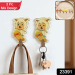Two cartoon sheep on skateboards, acting as wall hooks, with a bag and keys hanging from them, and a '2 Pc Mix Design' label.