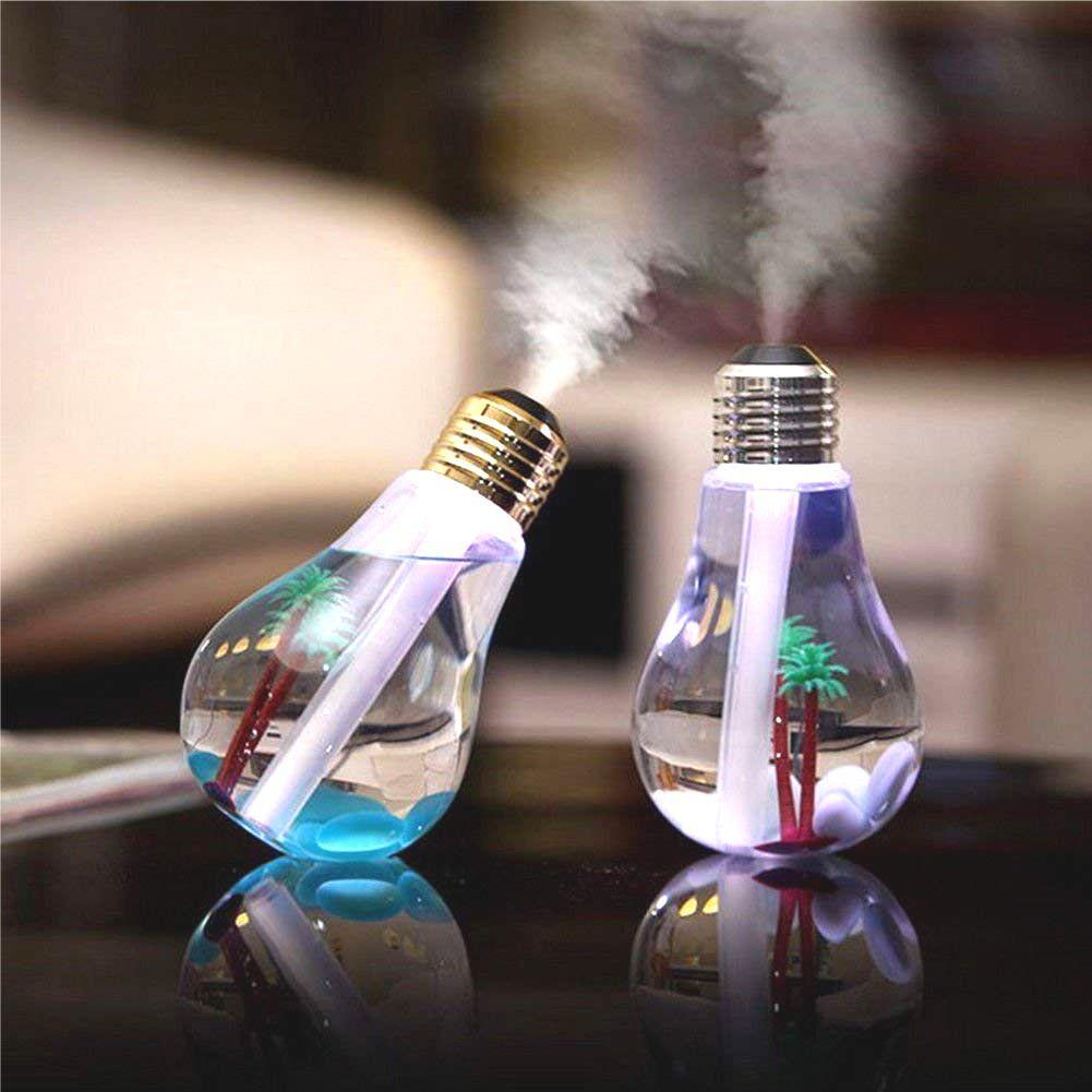 Two bulb-shaped humidifiers, one blue and one purple, emit mist with palm trees inside.