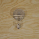 A clear, diamond-patterned self-adhesive hook with a silver hook, attached to a light wooden surface.