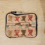 Person holding a compact travel organizer bag, ready for daily use.