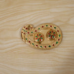 Golden Kumkum holder in its retail packaging