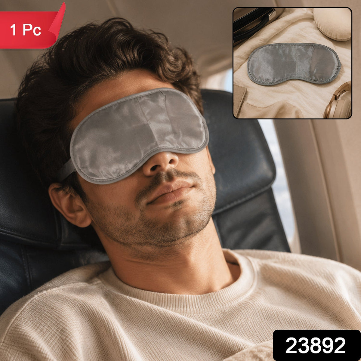 A man wearing a grey satin eye mask sleeps in an airplane seat, with an inset showing the mask on a beige blanket.