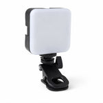 Portable LED camera light on white background